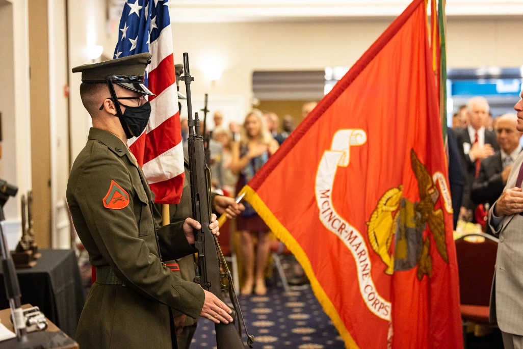 Soldiers presenting the U.S. Marine Corps flag.