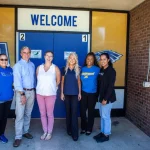 SURVICE employees Mikey Ray and Victoria Arcilesi with Aberdeen Middle School teachers and leadership.