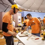 SURVICE Employees volunteer at the Wheelchair Costume Workshop.