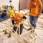 SURVICE Employees volunteer at the Wheelchair Costume Workshop.