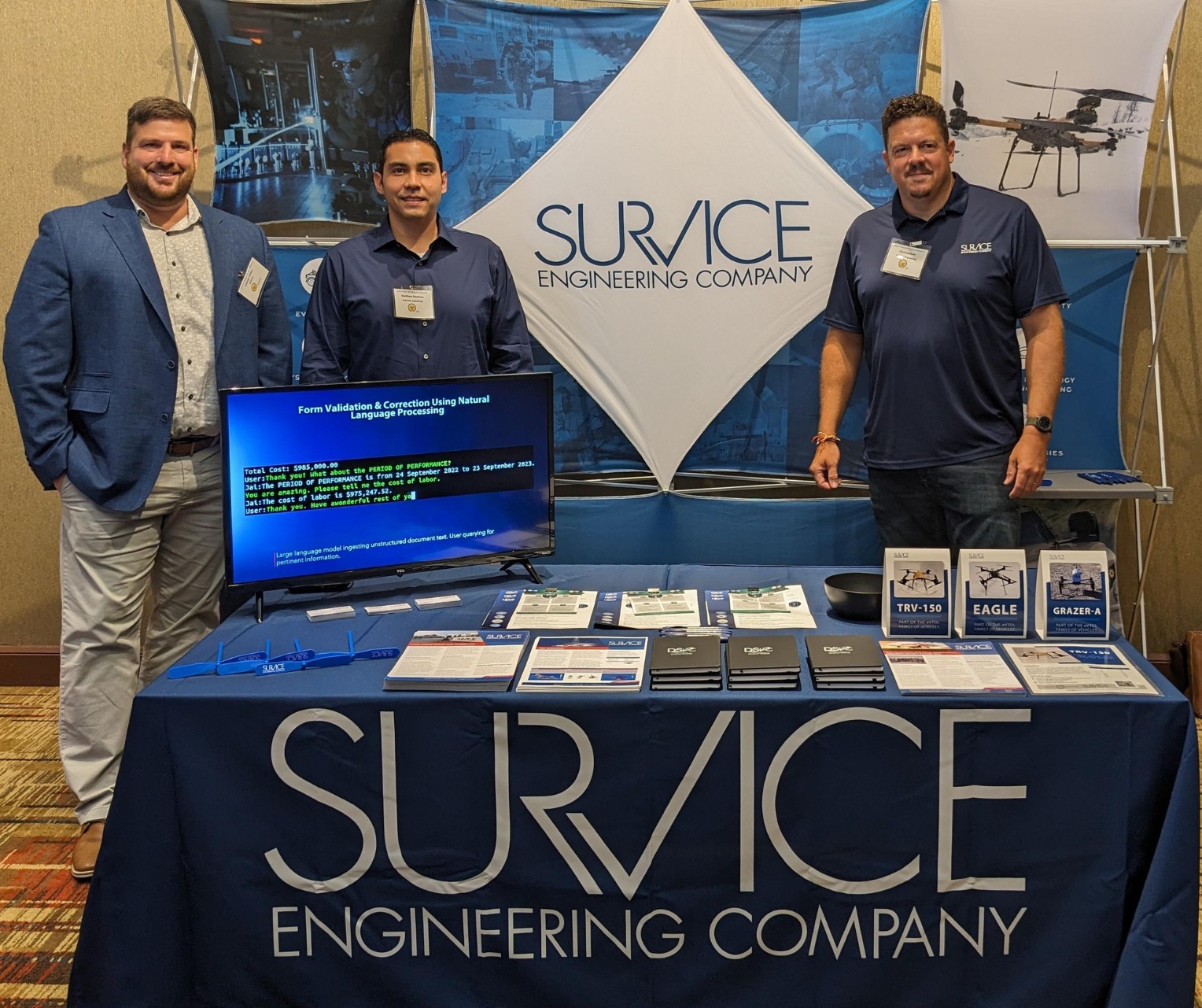 SURVICE employees at the booth.