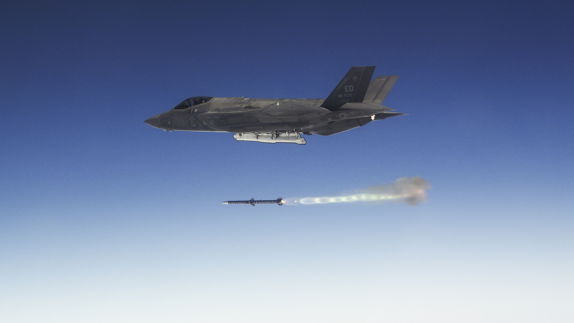 An Edwards AFB F-35A Lightning II fires an AIM-120 Advanced Medium-Range Air-to-Air Missile as part of Weapons Delivery Accuracy testing. The 461st Flight Test Squadron and F-35 Integrated Test Force completed WDA testing in early December, which concludes a large and important part of F-35 developmental test and evaluation. (Courtesy photo by Chad Bellay/Lockheed Martin)