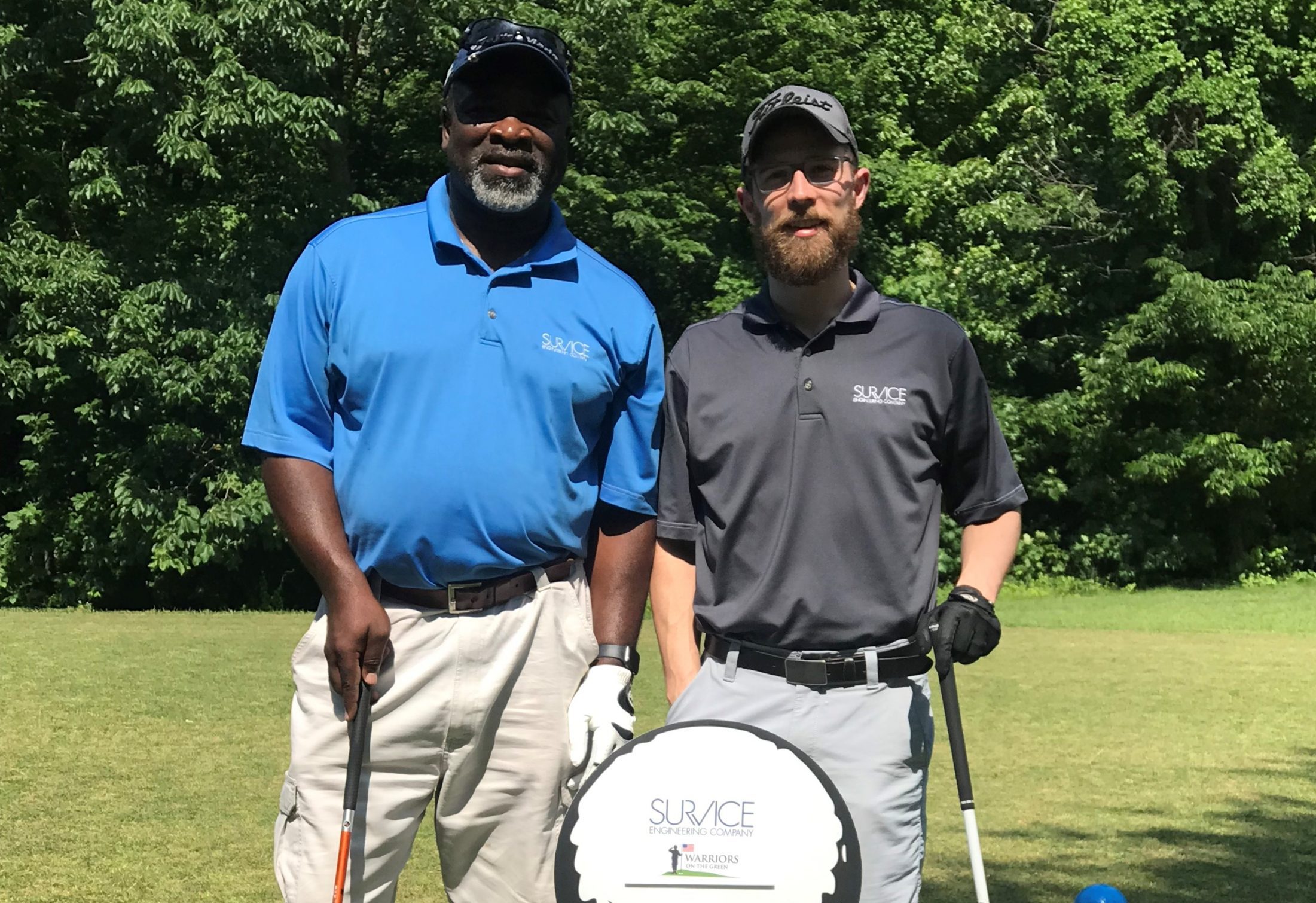 Ray Hall and Jordan Matthews at golfing event