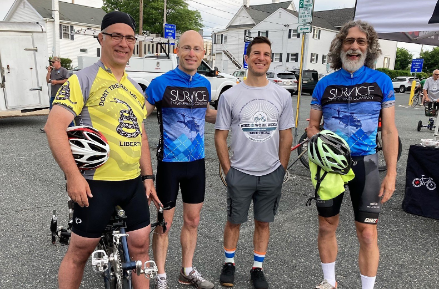 Employees Stephen Franzoni, Dick Schwanke, Brian Benesch, and Tim Farm participating in Bike to Work Day