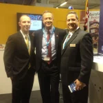 SURVICE employee Jordan Matthews (left), Maryland Governor Martin O'Malley (middle), and SURVICE employee Mark Butkiewicz