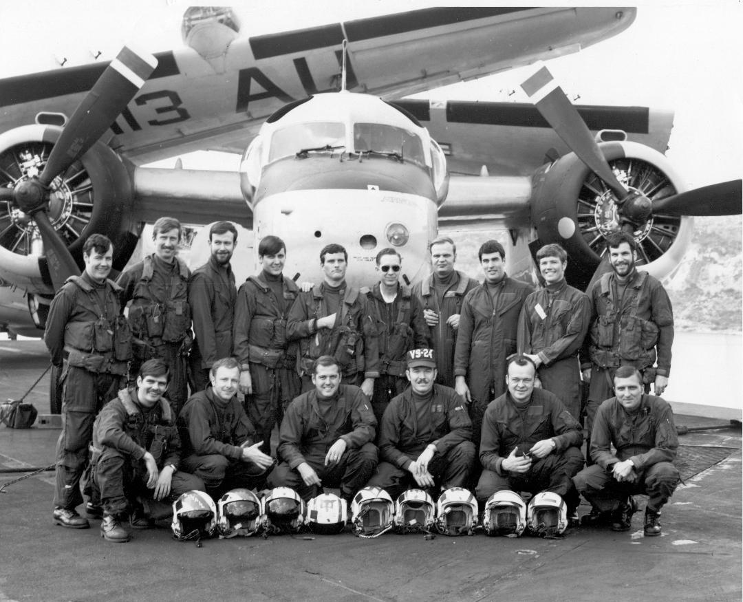 Mike Hewlett (far left, front row) with other officers in VS-24 posing in front of one of our S-2E Trackers (aboard USS Intrepid [CVS-11] in the Norwegian Sea, 1972).