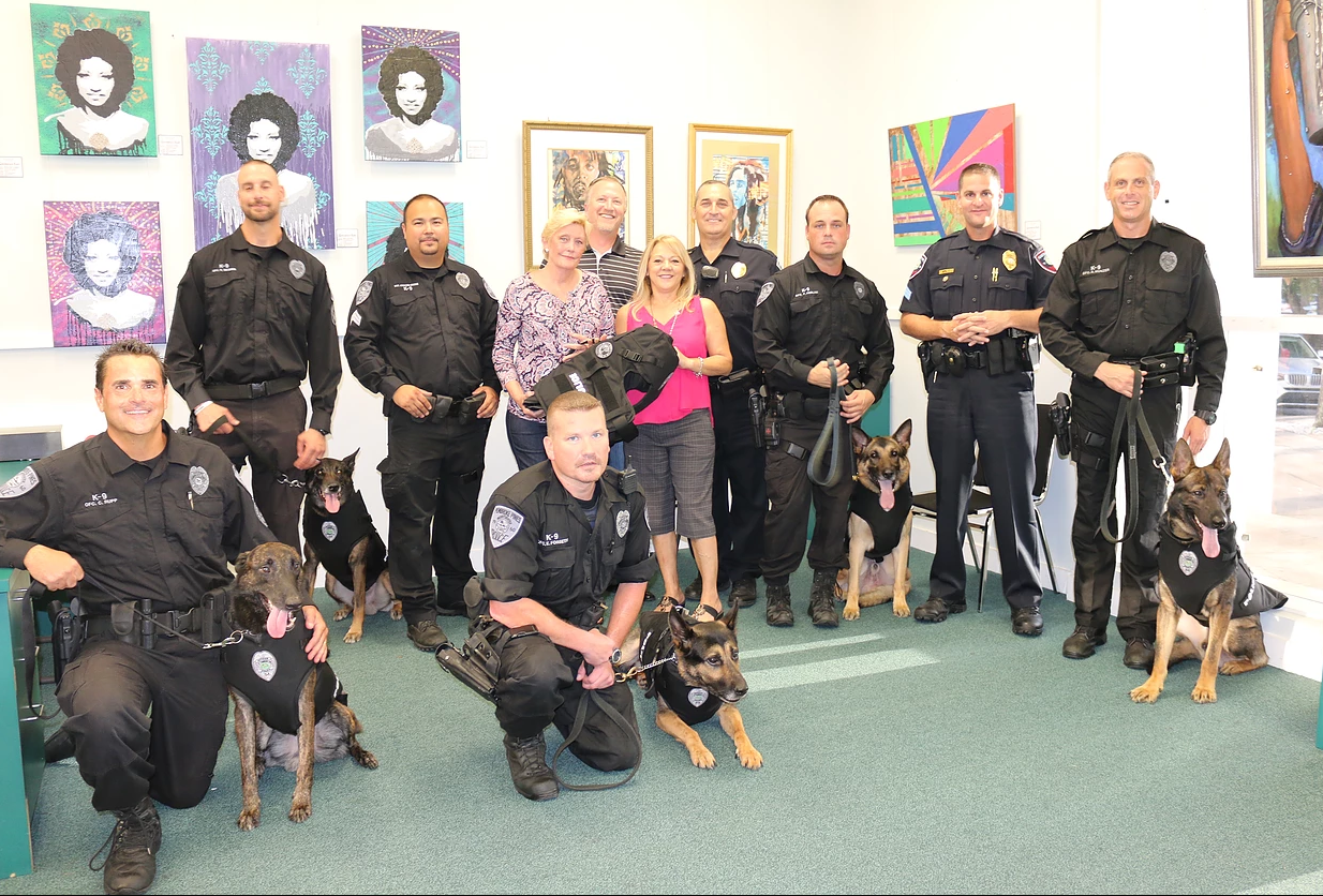Police officers with their K-9 partners