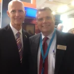 SURVICE employee Wink Yelverton (right) with Florida Governor Rick Scott